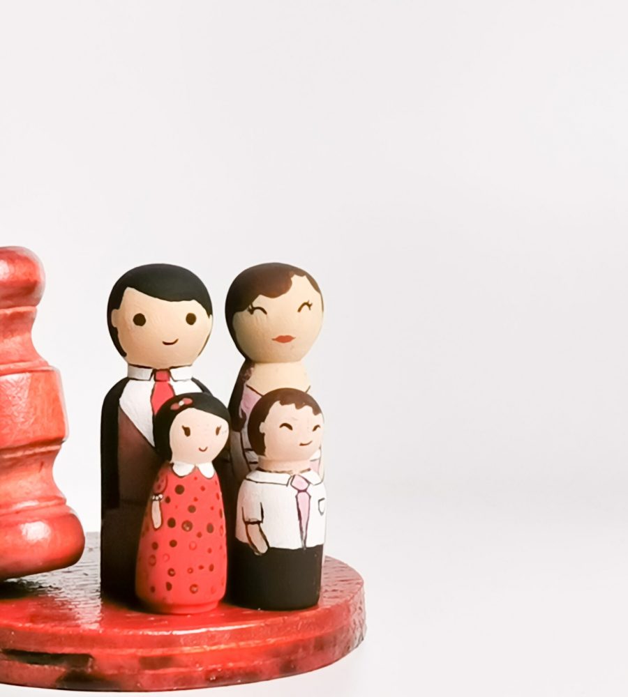 family-law-concept-wooden-dolls-family-with-gavel-2022-11-08-08-36-45-utc